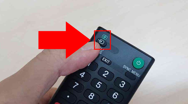 Dùng remote bấm vào nút nguồn vào của TV
